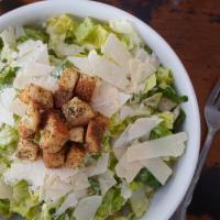 Caesar · Romaine, shaved romano, asiago and parmesan, house croutons, Caesar dressing.
