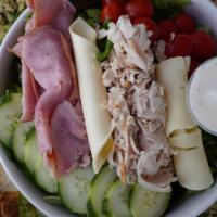 Chef Salad · Little leaf lettuce, turkey, ham, provolone, American, cucumber, tomato.