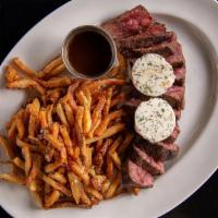 Steak Frites · 14 oz. center cut black angus, red wine shallot butter, truffle pomme frites

contains dairy