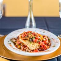 Mediterranean Flounder  · Served with olives, roasted peppers, clam, and capers in a pomodoro sauce. Accompanied with ...