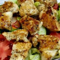 Grilled Chicken Salad · Fresh garden vegetables topped with marinated grilled chicken.
Served with Syrian bread and ...