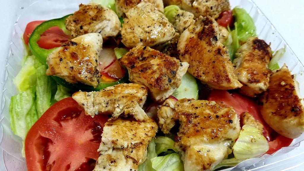Grilled Chicken Salad · Fresh garden vegetables topped with marinated grilled chicken.
Served with Syrian bread and your choice of dressing on the side.