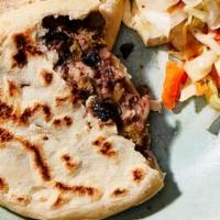 Pupusa · Corn flour pancake filled with cheese, beans & sautéed until golden brown. Served with curti...