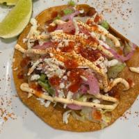 Tostada · Fried corn tortilla, your choice of filling, toppings & sauce