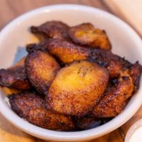 Fried Plantains · Generous portion of sweet plantains, deep fried till golden brown & served with sour cream.