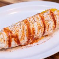 Corn Elote · Boiled sweet corn, smothered in our sour cream/mayo aioli, coated in authentic Cotija cheese...
