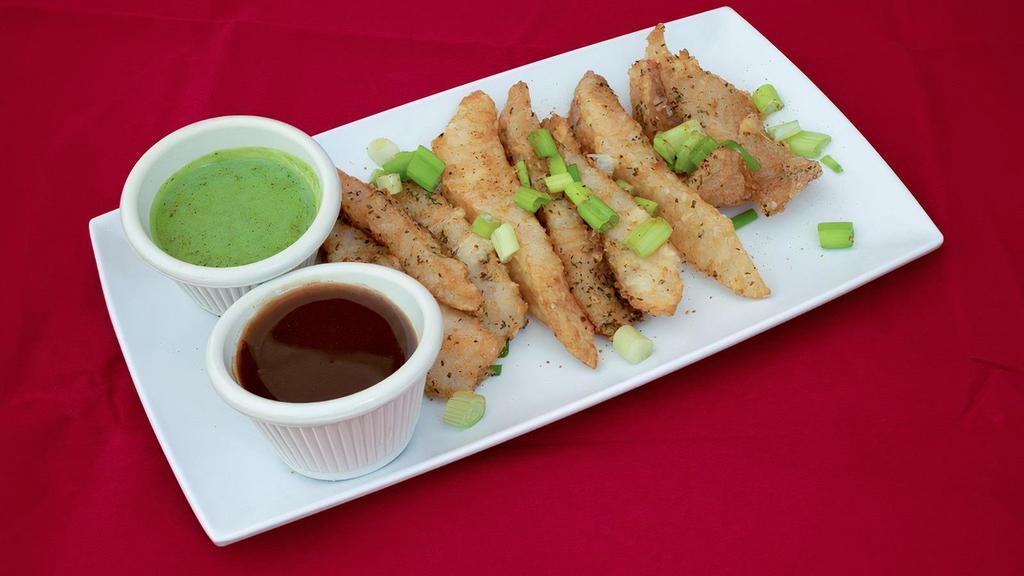 Amritsari Fish Pakora · Indian style battered fish is a lightly battered fish in Indian flavors, fried to a golden consistency to attain that perfect crunch and lightness