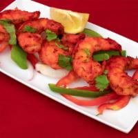 Tandoori Shrimp · Shrimp marinated in ginger garlic paste, grilled delicately.