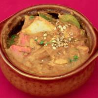 Kadai Chicken · Chicken Breast & Thigh pieces cooked in classic Indian Onion & Tomato curry, fresh green pep...