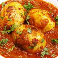 Egg Curry · Classic Indian curry with boiled eggs cooked in tomato and onion gravy.