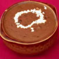 Dal Makhani · Creamy black lentils cooked with onions & tomatoes.