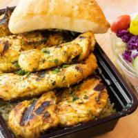 Grilled Chicken Dinner · Served with rice and salad.