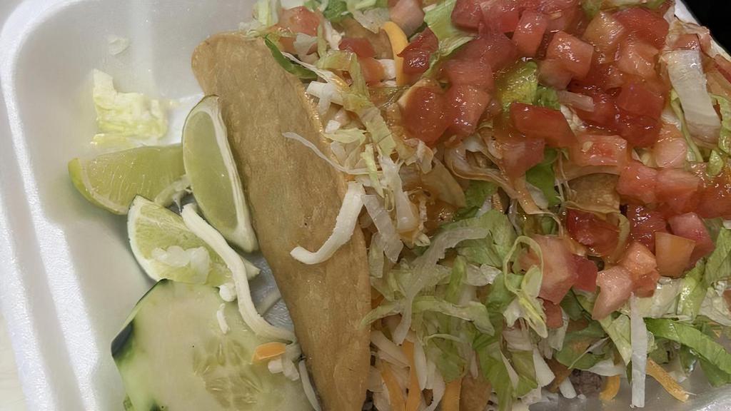Crispy Taco · Cheese, sour cream, lettuce, tomatoes, salsa, and a choice of meat.