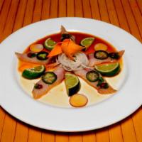 Yellowtail Jalapeño · Thinly sliced yellowtail, jalapeño topped with tobiko caviar and ponzu sauce.