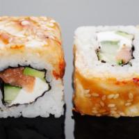 Mass Roll · Tuna, eel avocado inside with whole slightly torched salmon on top, served with spicy mayo a...