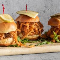 Pulled Chicken Sliders · Pulled chicken, BBQ sauce, cheddar cheese and onion straws.