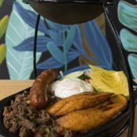 Súper Bandeja · Shredded Beef with tomatoes and onions, chicharrón, chorizo, avocado, sweet plantains, fried...