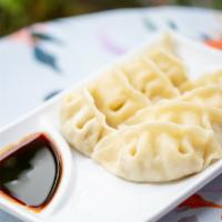 Steamed Chicken Dumplings (8) · Steamed chicken dumplings, served with our home made ginger dumpling sauce.
