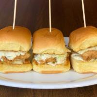 Crispy Chicken Sliders · battered & fried chicken tenders topped with house
made slaw & pickle slices. served on a po...