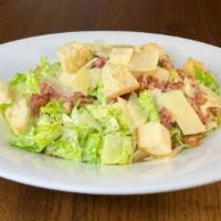 Caesar Salad · Crisp croutons, chopped bacon and shaved parmesan.
