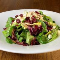 Noble House Salad · Mixed greens, almonds, goat cheese, cucumbers, and dried cranberries, tossed in a red wine v...