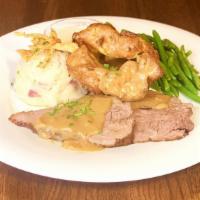 The Sunday Roast · sliced tender roast beef with mashed potatoes, rich
beef gravy, seasonal vegetables and york...