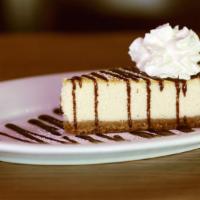 Bailey'S Cheesecake · Baked New York style cheesecake laced with bailey's Irish cream, drizzled with coffee and ch...