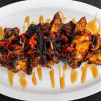 Charred Honey Hot Habanero · Topped with charred habanero peppers and glazed with wildflower honey.