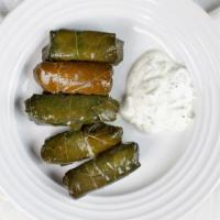 Stuffed Grape Leaves · Fresh grape leaves with mix vegetables and rice. Vegetarian