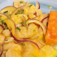 Ceviche Limeno · Gluten-free. Corvina fish marinated with Peruvian yellow peppers and Leche de Tigre.