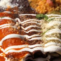 Enchiladas Tres Colores · Vegetarian and gluten-free. Three corn tortillas stuffed with cheese, topped with our homema...
