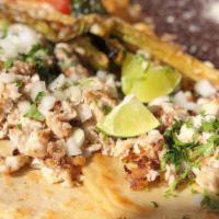 Red Snapper Tacos · Vegetarian and gluten-free. Four soft handmade corn tortilla tacos served with Mexican rice ...