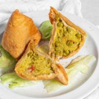 Veggie Somosa · Crispy triangular pastry turnovers filled with seasoned potatoes and green peas.