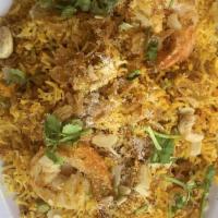 Shrimp Biryani · Tender shrimp cooked with basmati rice and traditional spices and herbs.