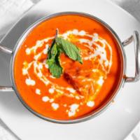 Chicken Tikka Masala · Breast meat chicken skewed in tandoor (clay oven) and sautéed in a rich creamy sauce topped ...