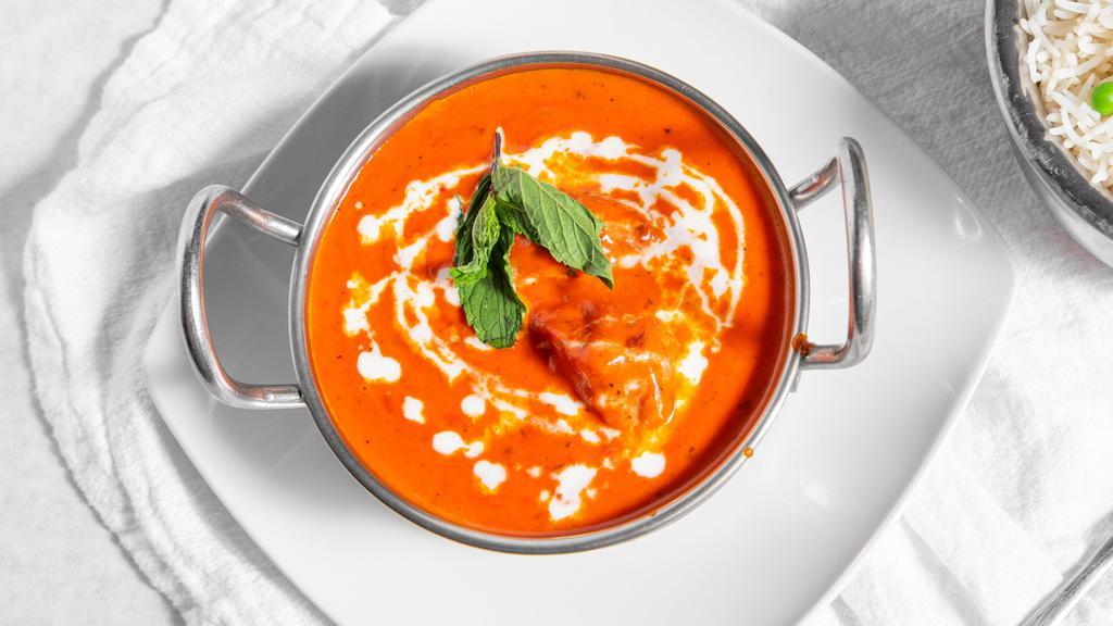 Chicken Tikka Masala · Breast meat chicken skewed in tandoor (clay oven) and sautéed in a rich creamy sauce topped with bell peppers.