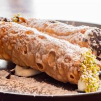 Cannoli · Stuffed with homemade ricotta cheese, finished with pistachio, chocolate chips.