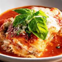 Lasagna · Classic handmade lasagna, tomato sauce, bolognese, ricotta, mozzarella.