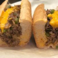 76Ers Cheesesteak · MUSHROOMS, GREEN PEPPERS, GRILLED ONIONS, & CHEESE WIZ. SERVED ON A FRESH BAKED LONG ROLL.