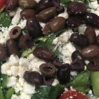 Greek Salad · ROMAINE LETTUCE TOPPED WITH TOMATOES, CUCUMBERS, CROUTONS, KALAMATA OLIVES & FETA CHEESE. SE...