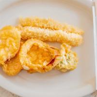 Tempura · Chicken or shrimp (2 Pc) and veggies served with tempura sauce.