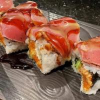 Tuna Amazing · Spicy tuna, white tuna tempura, avocado topped with pepper tuna, wasabi aioli and eel sauce.