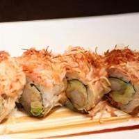 Angry Dragon · Shrimp tempura, avocado, topped with spicy kani, sweet potato, orange edamame sauce.

.