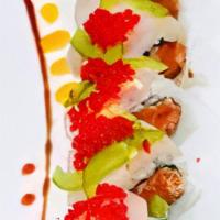 Kiss Of Fire · Spicy crunchy tuna topped with yellowtail jalapeno and tobiko.  Consuming raw or undercooked...