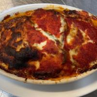 Eggplant Parmigiana · Egg battered and baked with mozzarella cheese and marinara sauce.