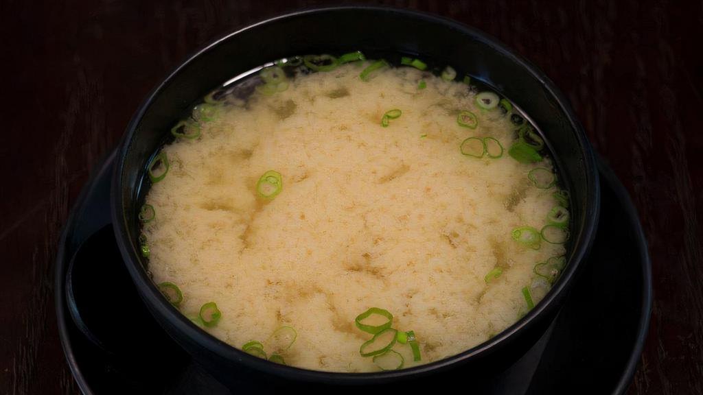 Miso Soup · Traditional Japanese miso soup served with tofu, seaweed and scallion.