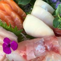 Sake Sashimi · Salmon. Four pieces over daikon.