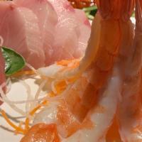 Ebi Sashimi · Steamed shrimp. 4 pieces over daikon.