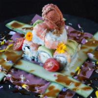 Butterfly Maki Roll · Lobster tail tempura and cream cheese topped with avocado, steamed shrimp and honey peanut s...