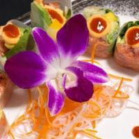 Holiday Maki Spicy Roll · Spicy. Spicy tuna, fresh mango, mixed greens, avocado, and cucumber in a rice paper wrap, to...
